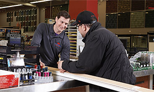 Checking out a customer at the store counter